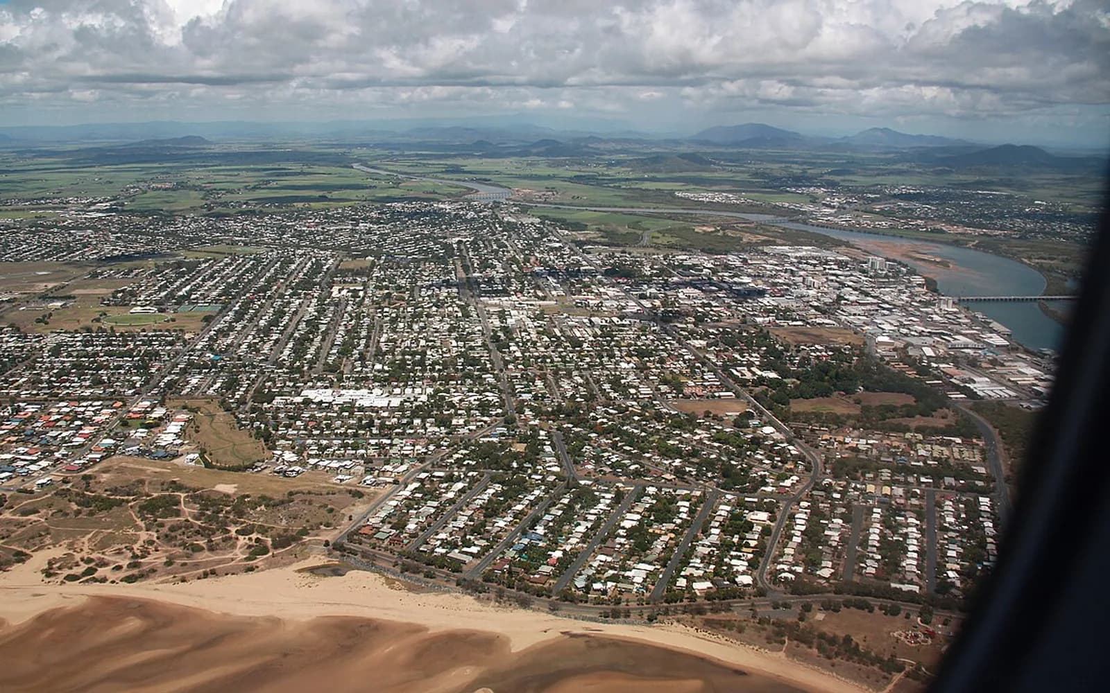 Aerial view across Mackay, the Pioneer River and the Queensland coast