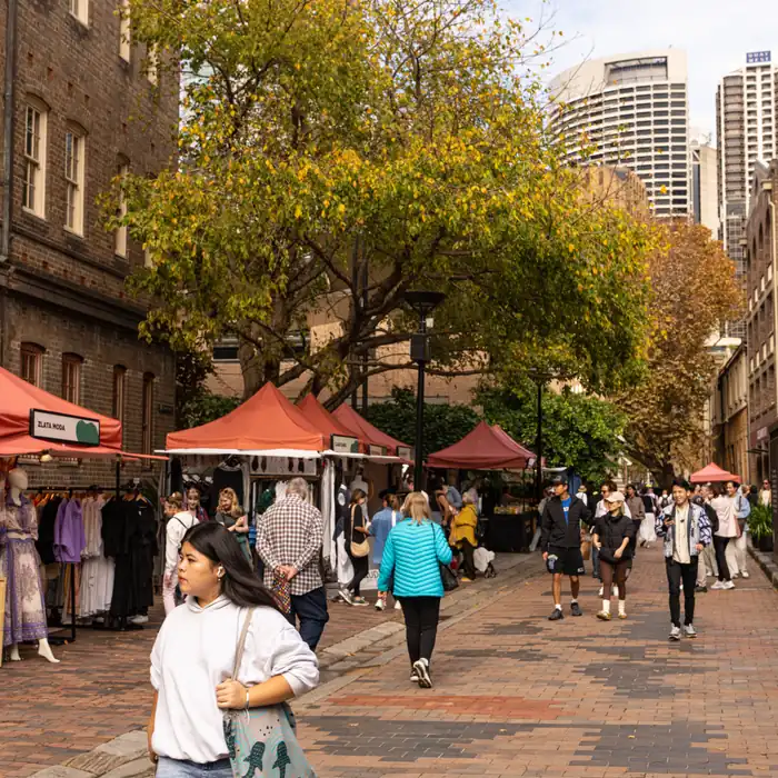 People browsing a weekend street market in The Rocks, Sydney