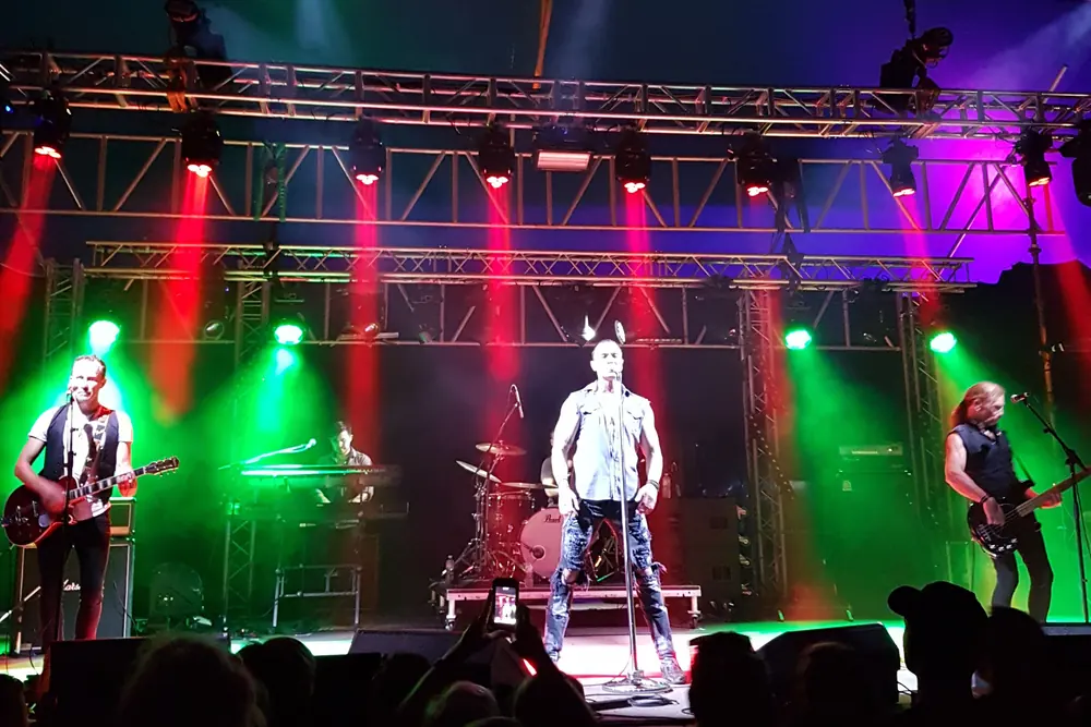 Live band performing on a professionally lit Australian venue stage
