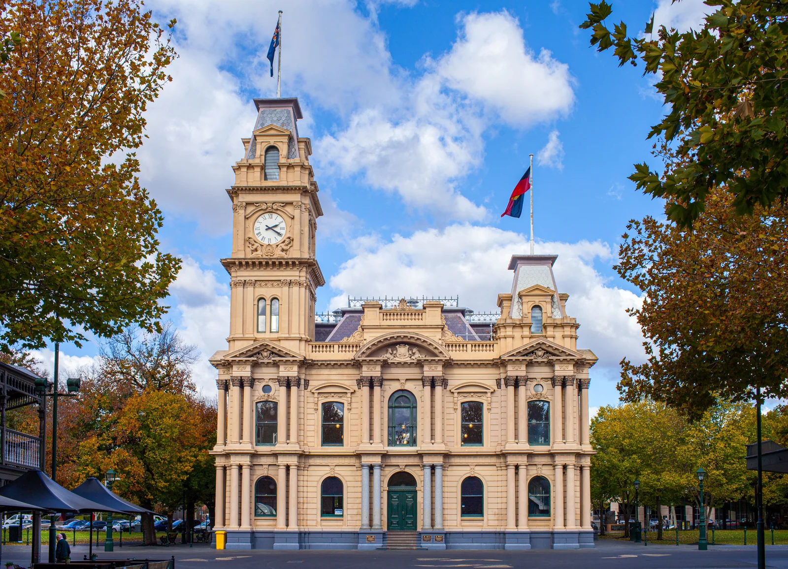 Bendigo Town Hall framed by autumn foliage