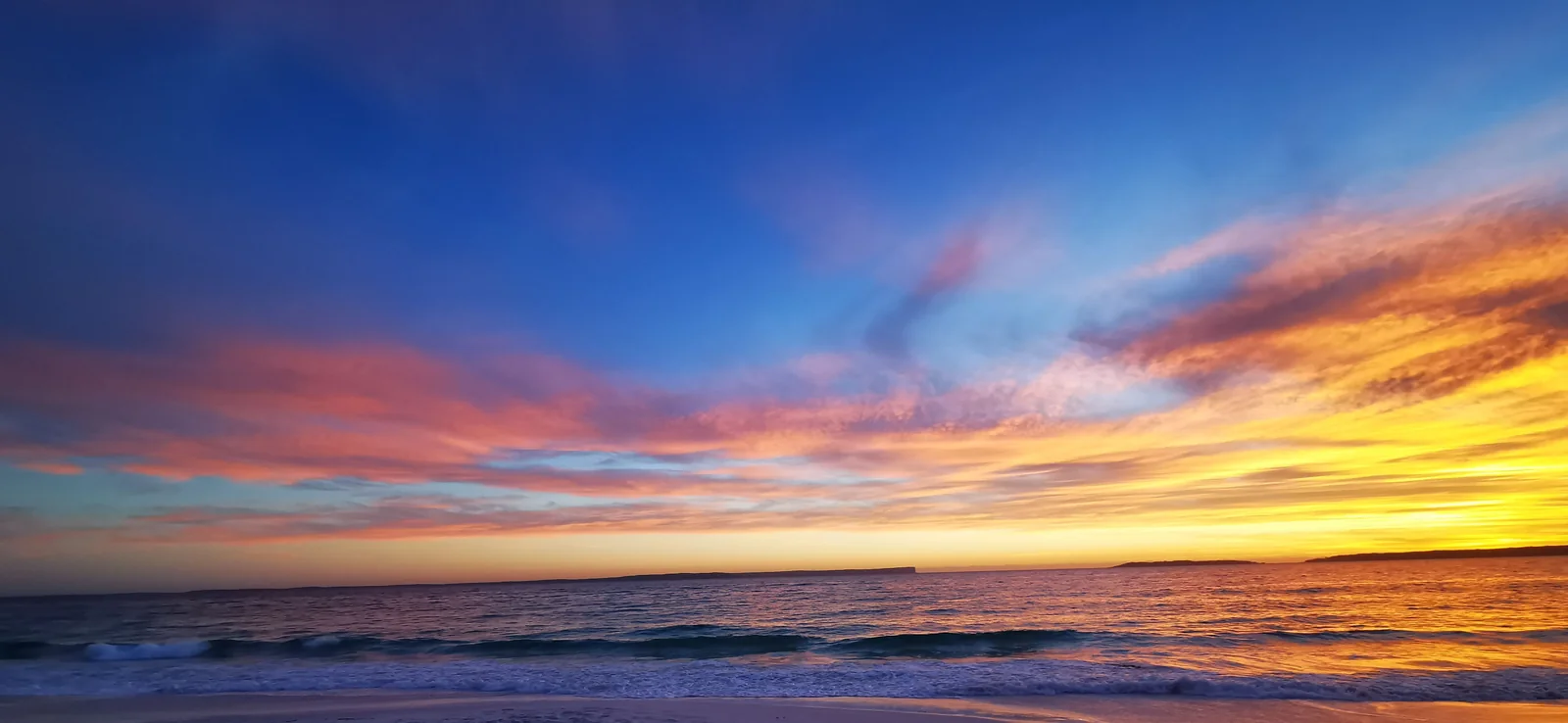 Sunset over waves on the New South Wales shore of Jervis Bay