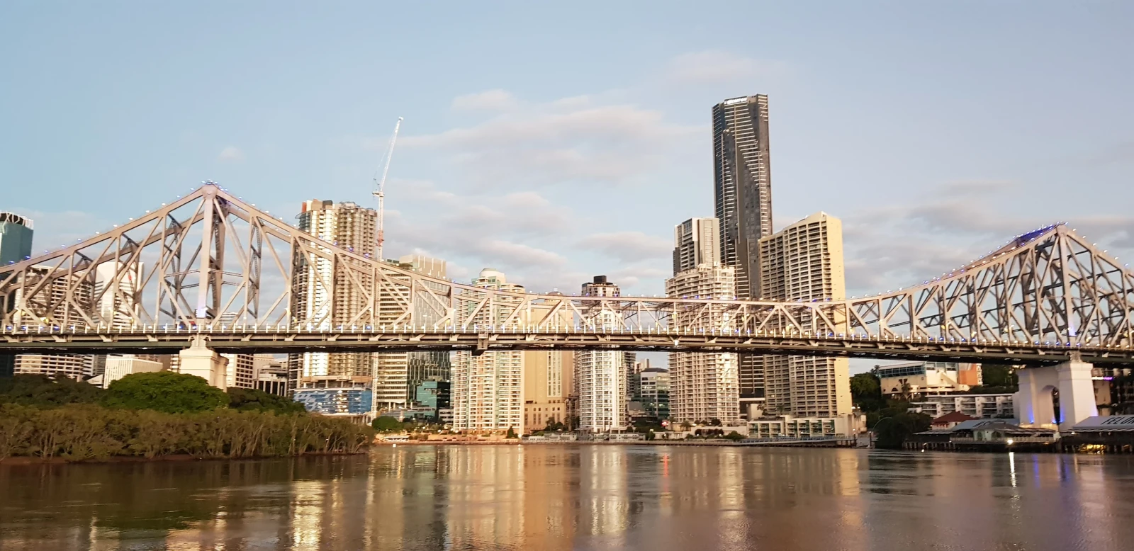 Brisbane's Story Bridge and city buildings reflected in the Brisbane River